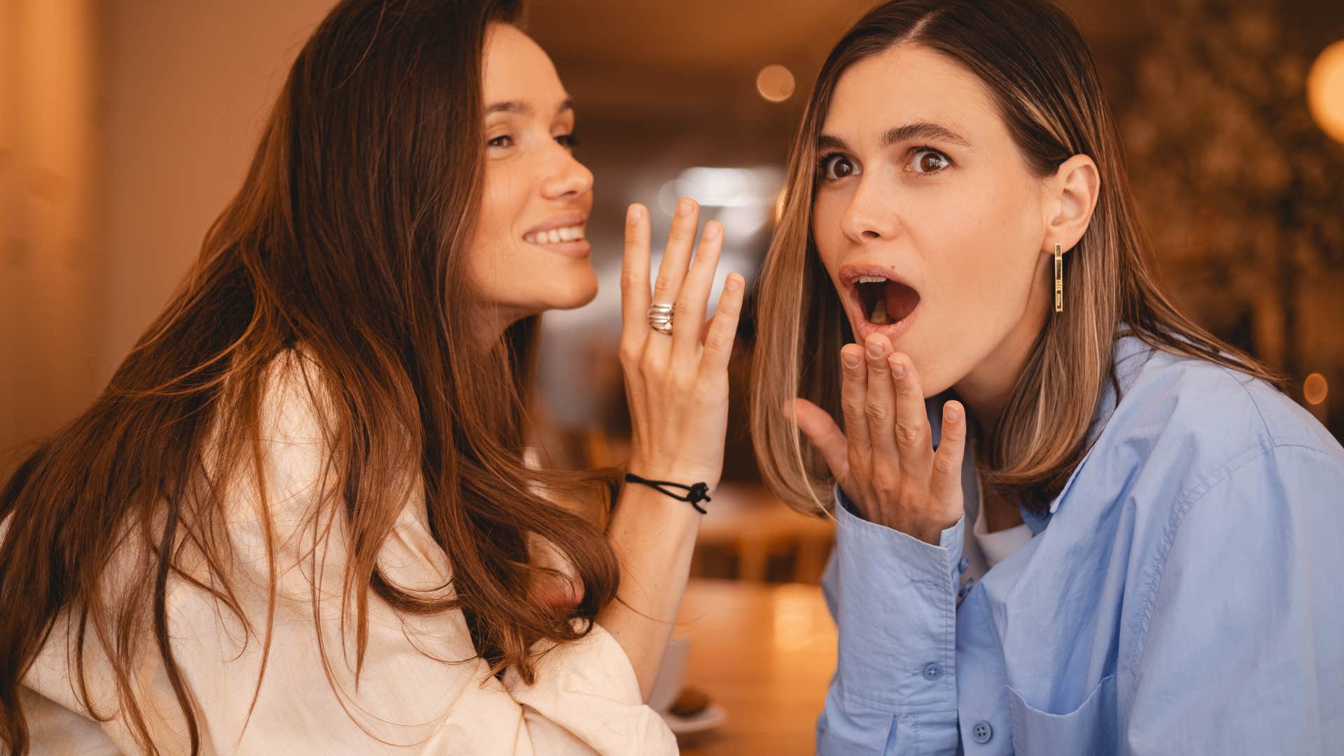 jealous woman gossiping behind friend's back
